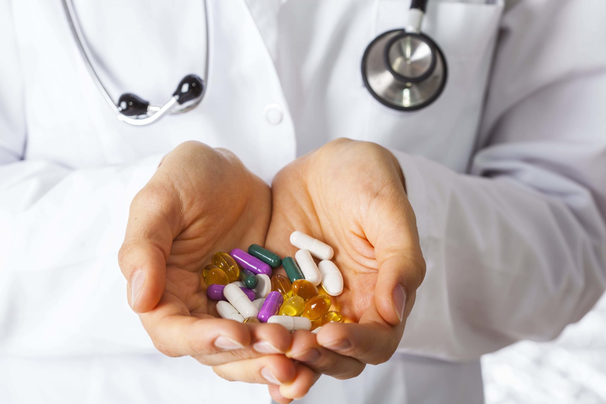 nurse holding prescription pills