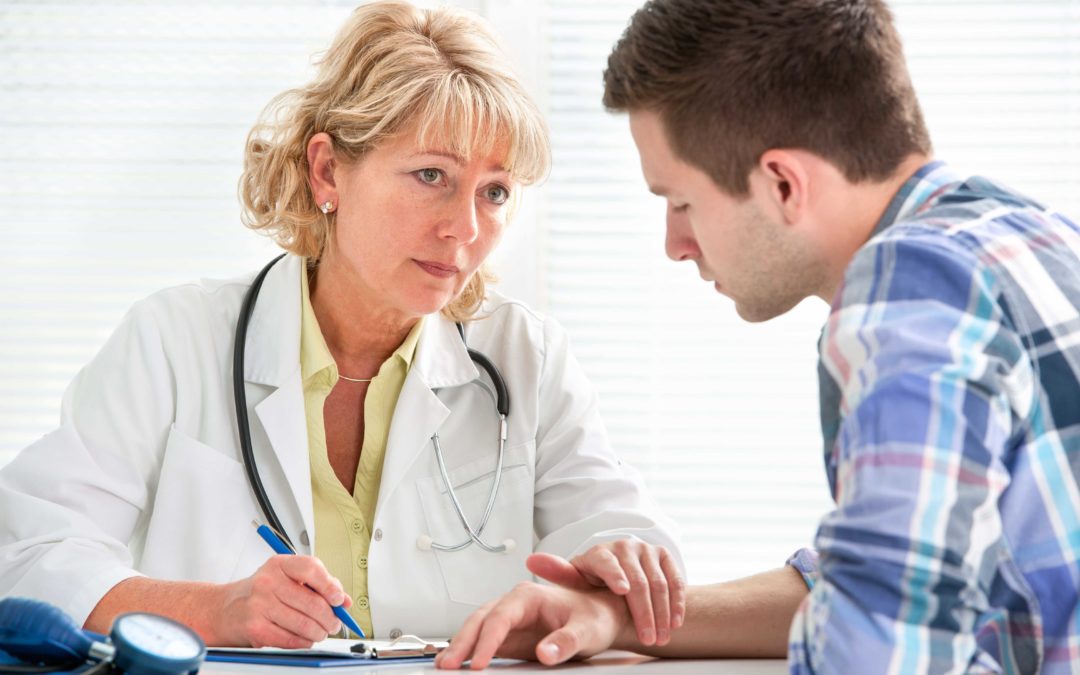 doctor explaining medication assisted treatment to a patient