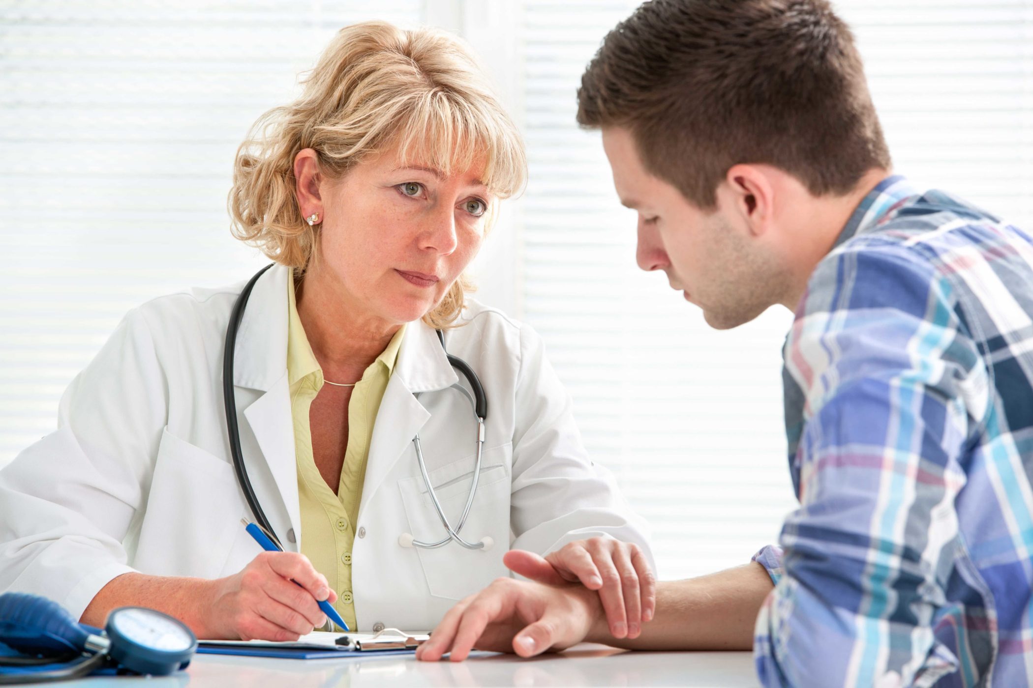 doctor explaining medication assisted treatment to a patient