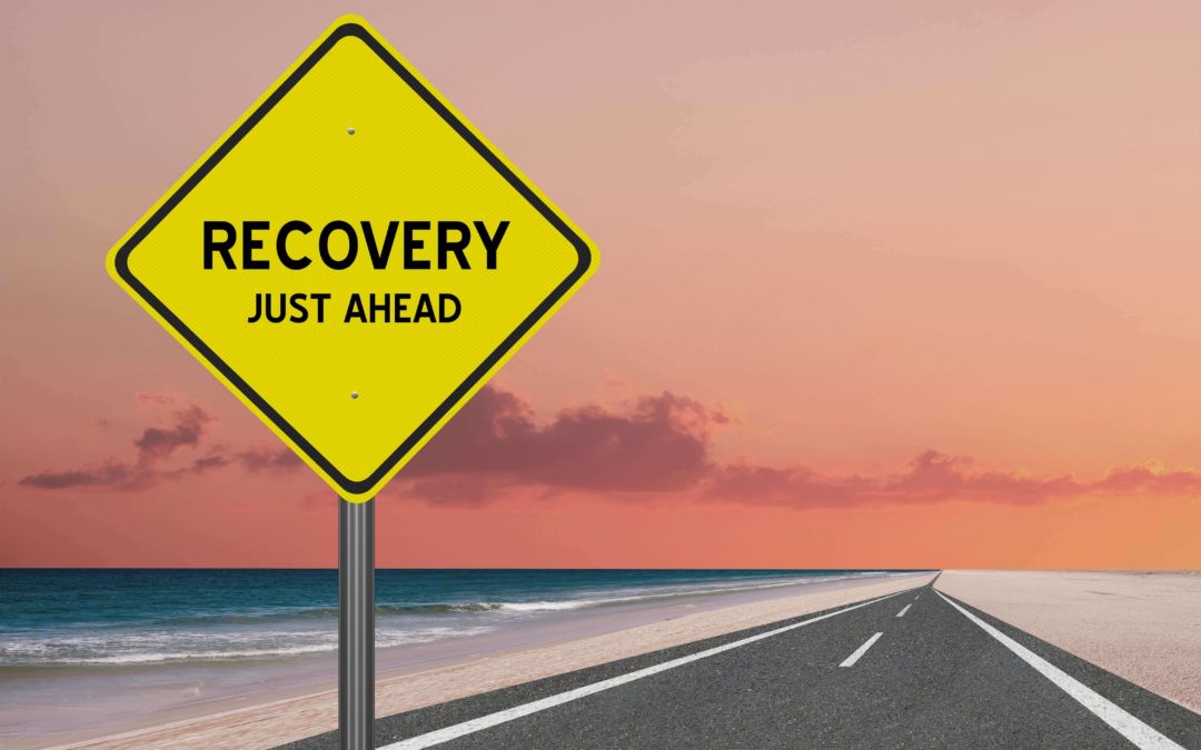 recovery sign on a long road