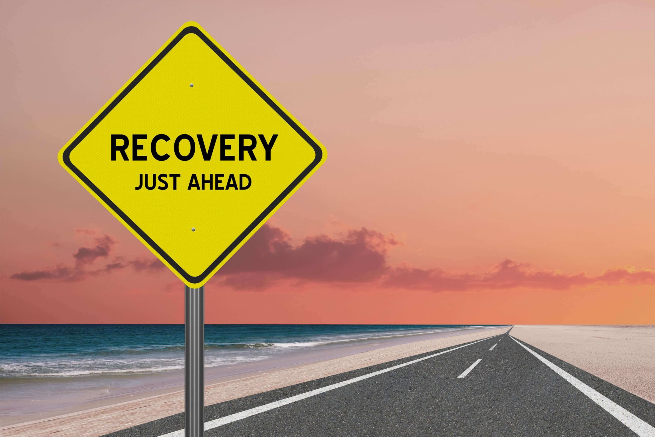 recovery sign on a long road