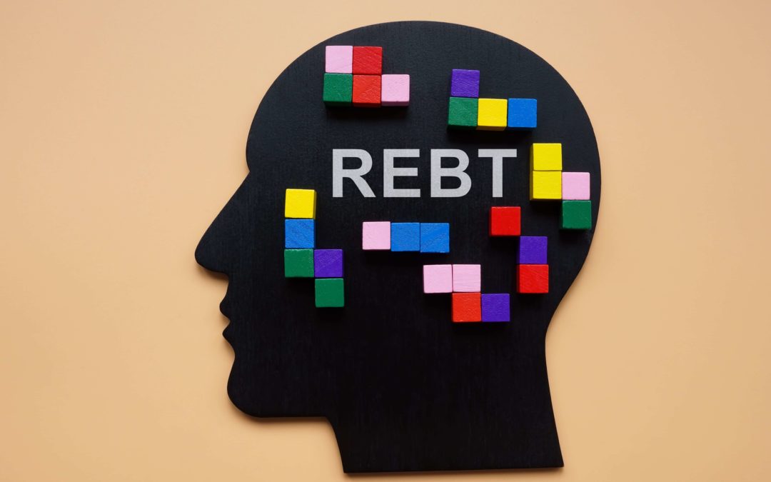 REBT written out in a head with colorful cubes