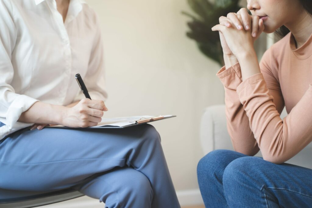 doctor writing prescription for patient with anxiety