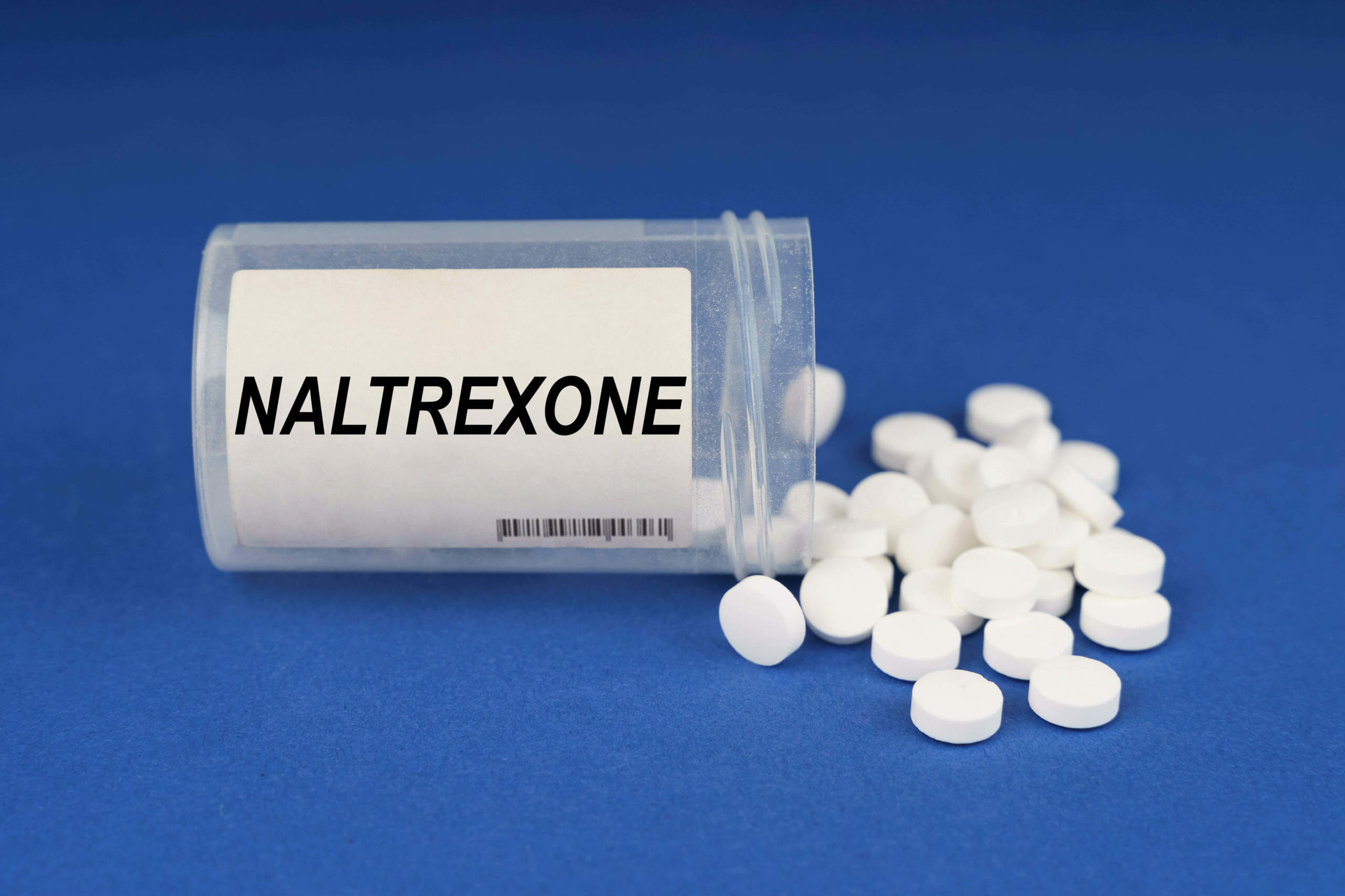pills coming out of a naltrexone bottle