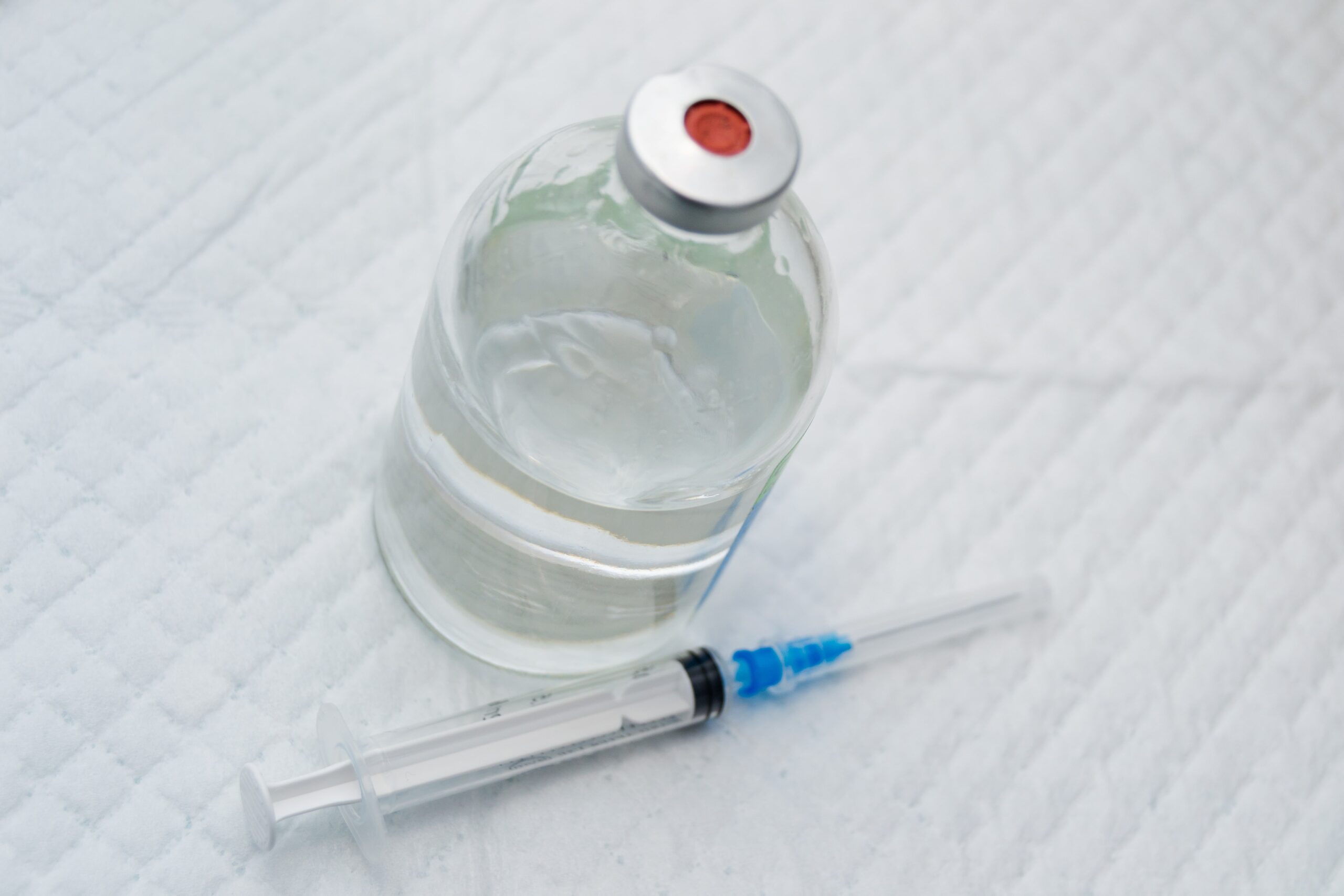 bottle of xylazine next to syringe